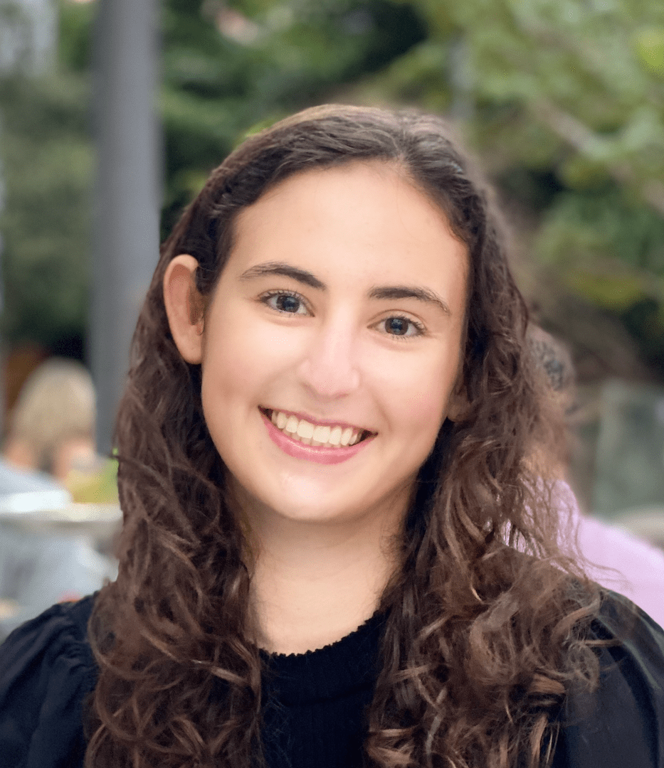 Brooke Greenberg in black shirt smiling